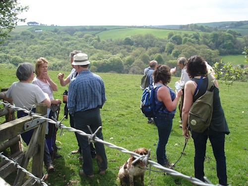A welcome break as the group enjoy views over the Iron Mill Stream valley